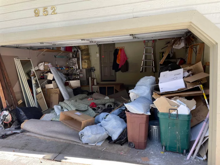 garage full of unwanted items ready to be cleaned out by Bay Area Demo and Hauling